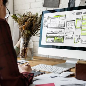 Web developer laying out a website with UX
